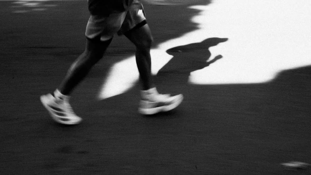 A pair of running shoes on a pavement