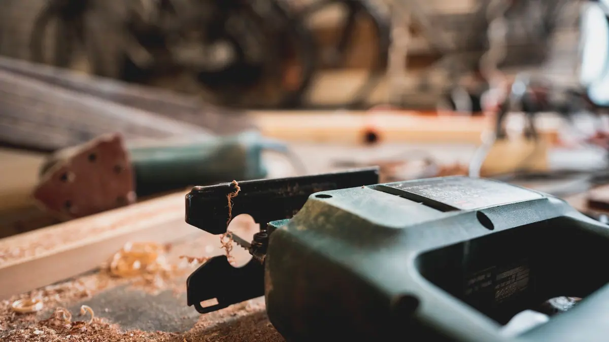Well-used hand tools arranged on a wooden bench