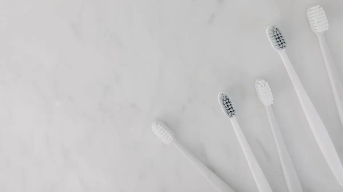 An electric toothbrush head close up showing bristles