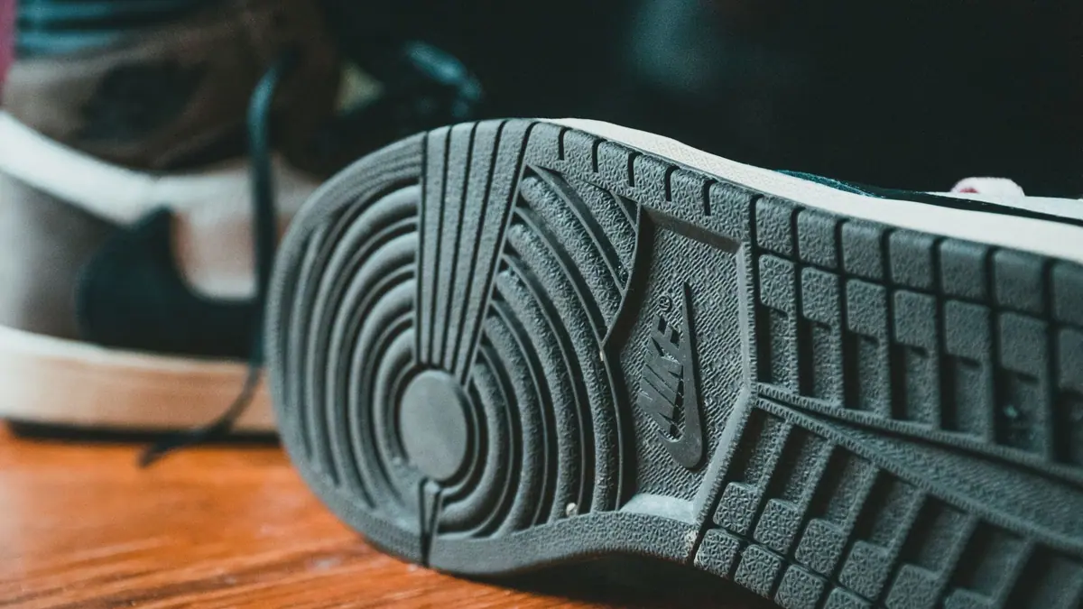 A worn running shoe outsole showing tread wear