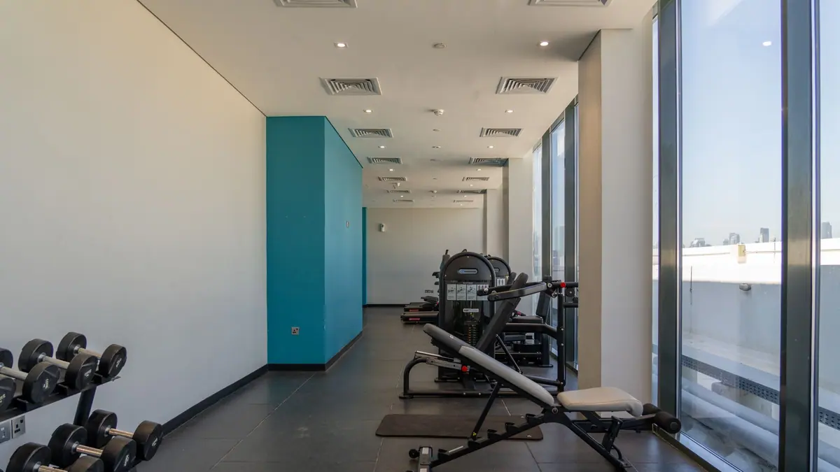 A treadmill in a room with a window
