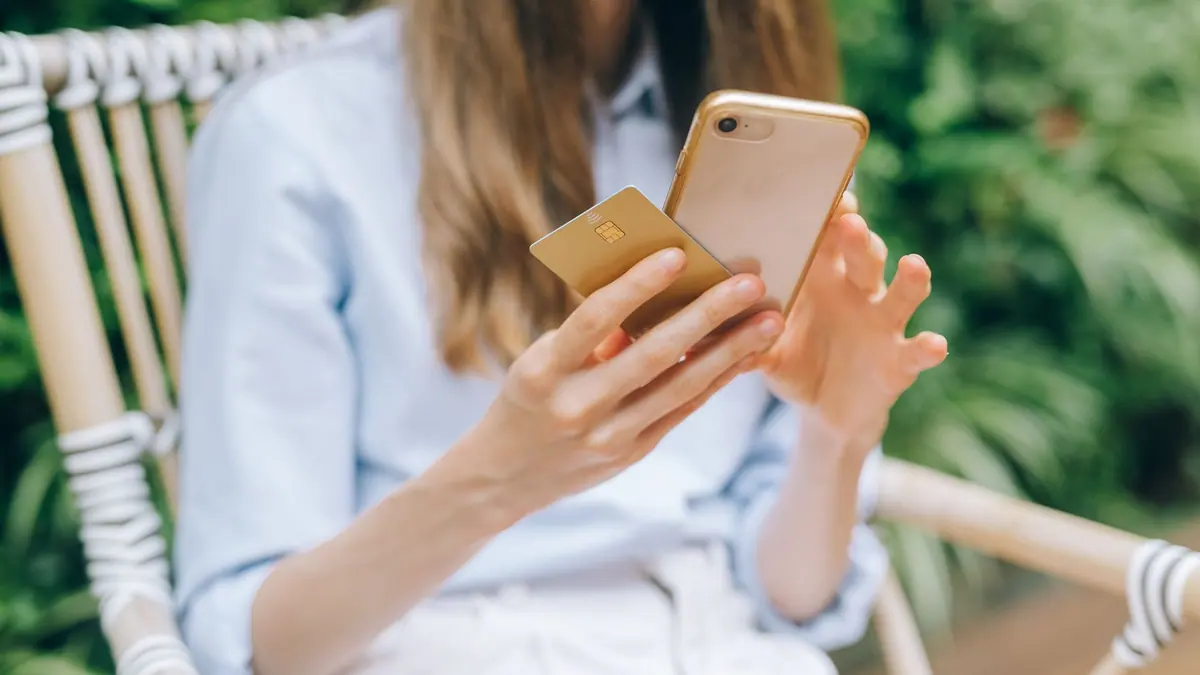 A person checking a banking app on a phone