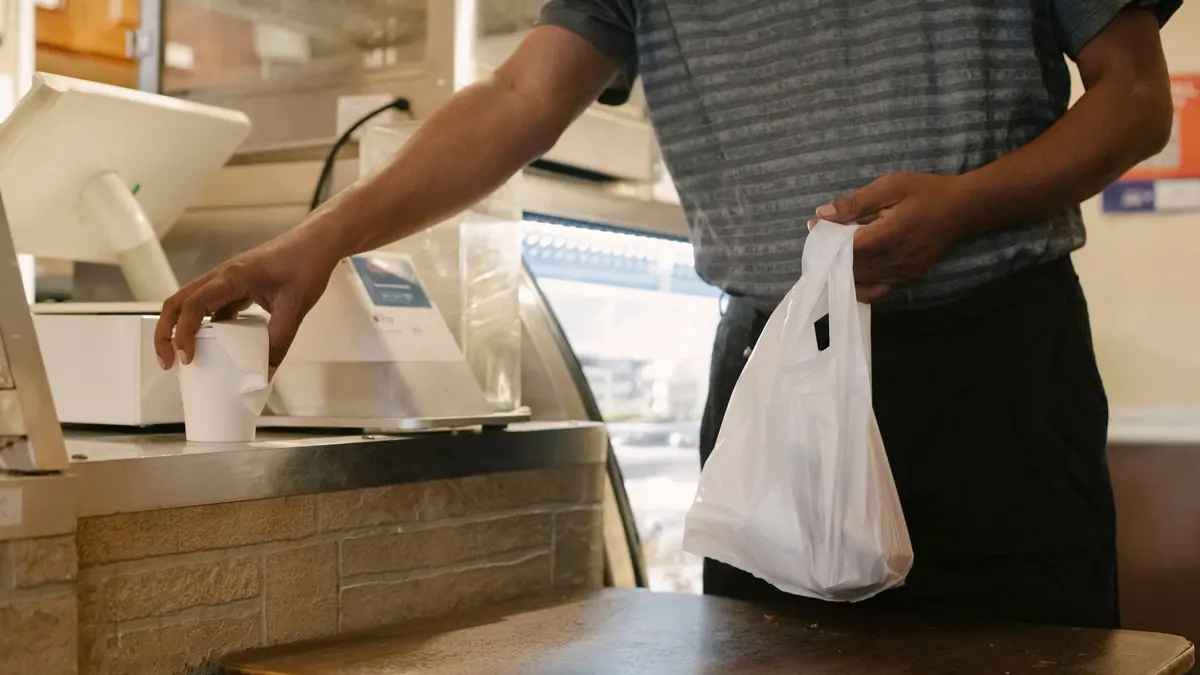 Shopping bags and a receipt on a table