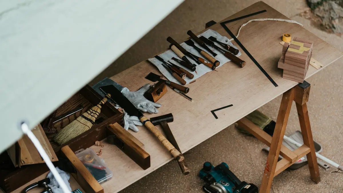 Hand tools laid out on a workbench